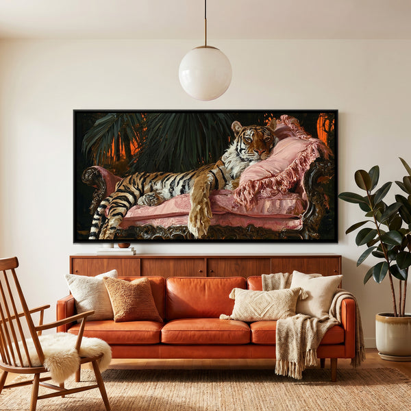 Tiger on Pink Sofa — framed canvas art hung on a wall